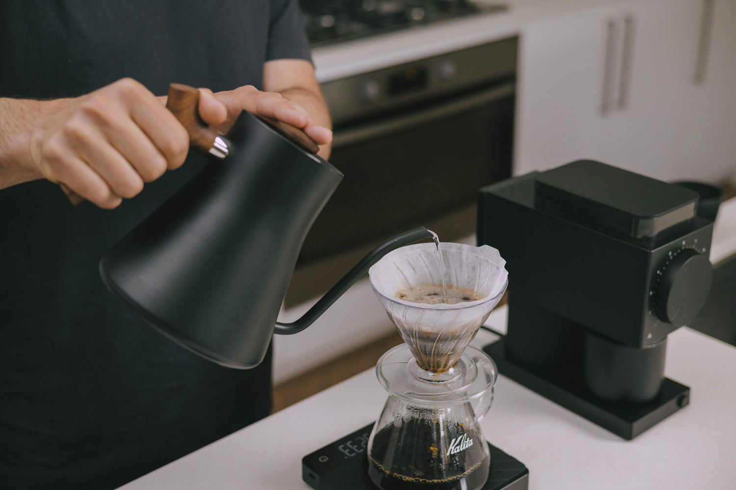 Cal demonstrating how to use brewing equipment in Perth