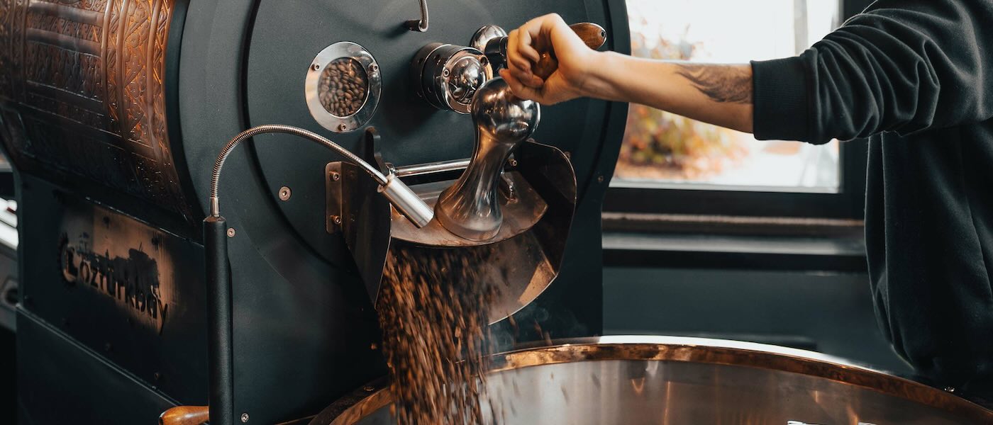 One of the best coffee roasters in Perth working an industrial grinder