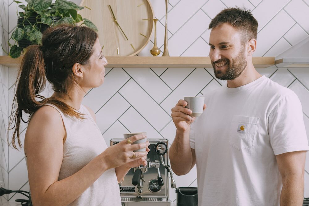 Man and woman drinking wholesale coffee in Perth at work